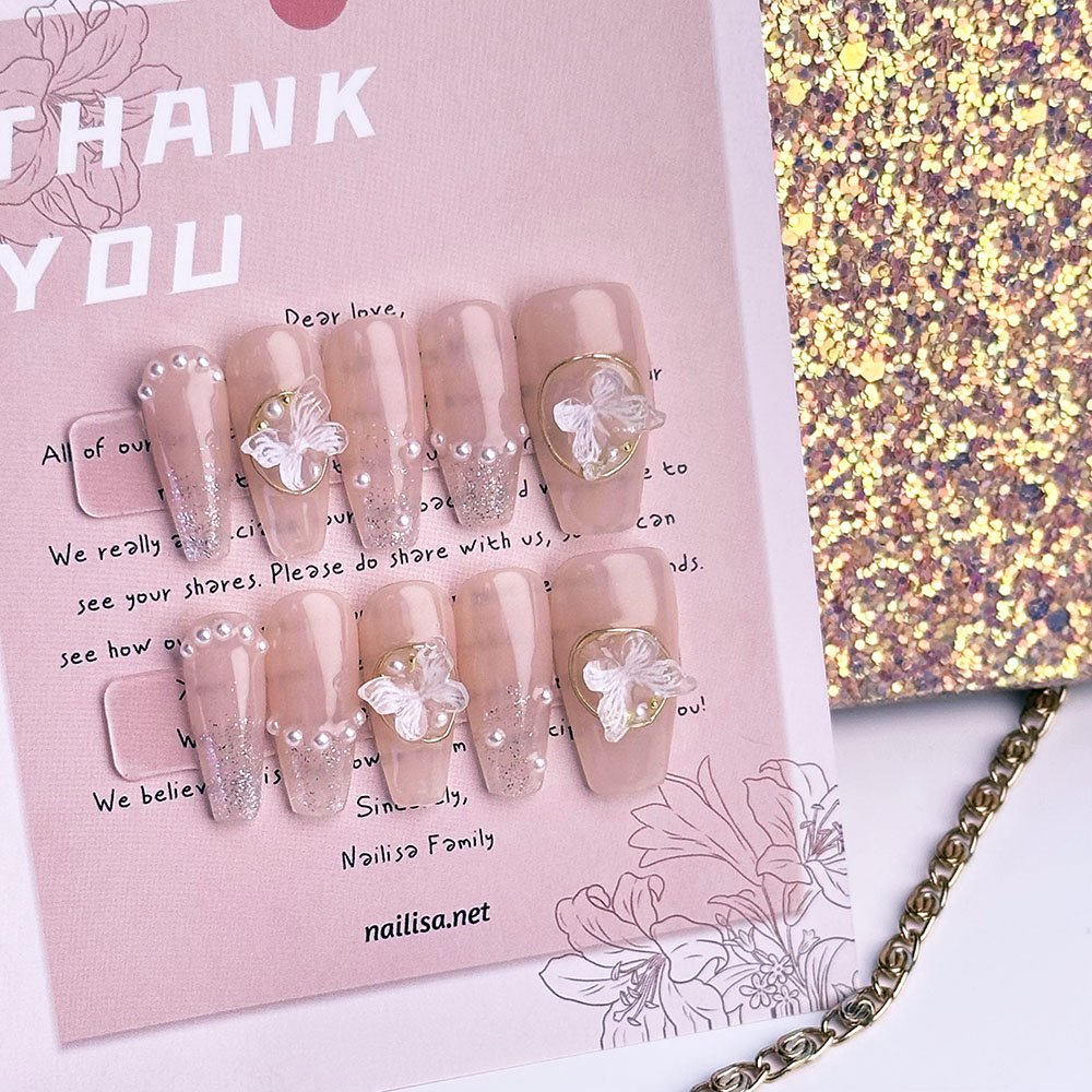 Nude Pink Sheer Press-On Nails with 3D Butterfly Bow | Long Pearl Glitter - Image 4