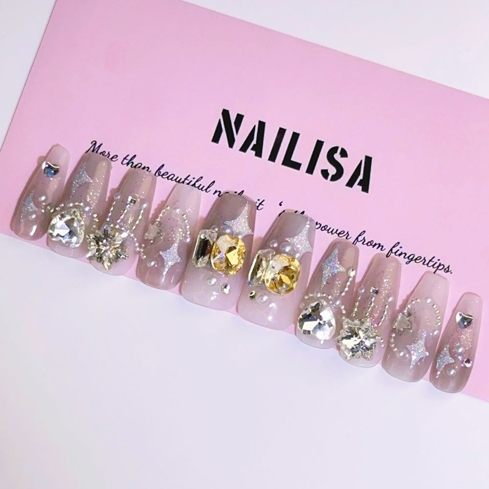Uñas postizas translúcidas con purpurina, estrellas, copos y perlas de pedrería | Largas